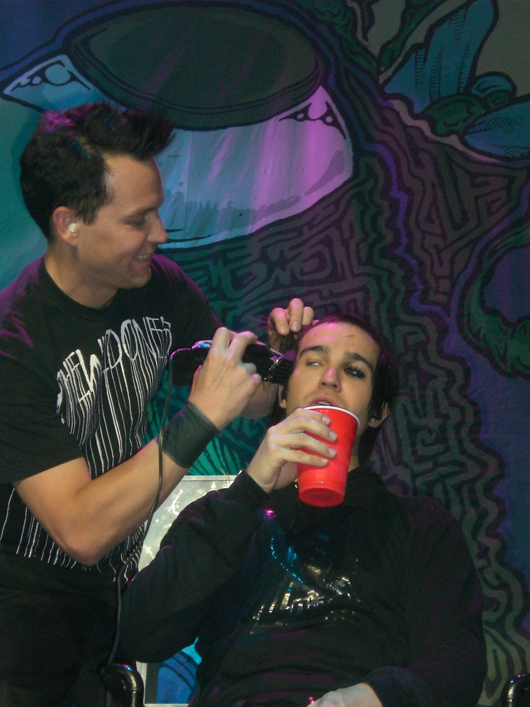 Mark Hoppus of Blink-182 shaving Pete Wentz's head during Fall Out Boy's final show at Madison Square Garden