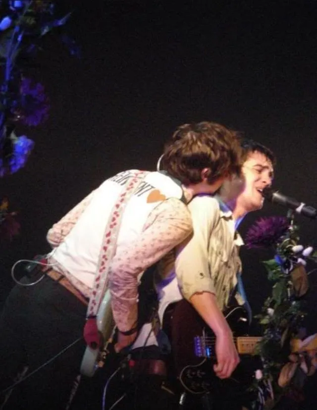 Ryan Ross onstage in his Reinvent Love vest during Panic! at the Disco's Pretty Odd era 